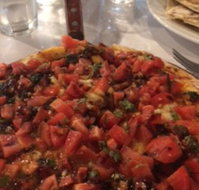 Caruso's Woodfired Pizzeria - Book Restaurant